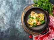 Минтай в молоке с луком на сковороде